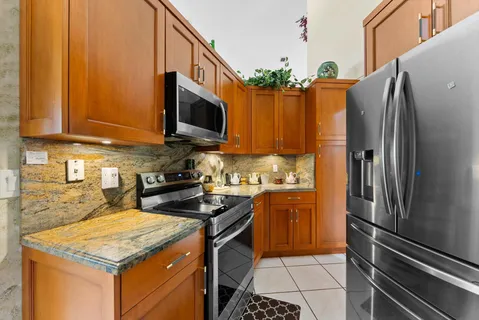 a kitchen with a stove and a microwave