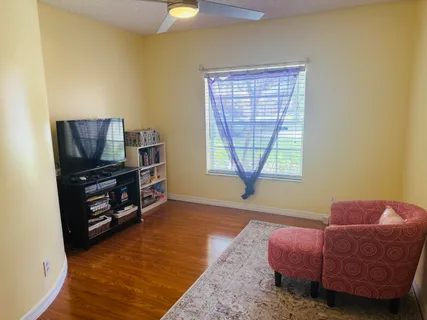 a bathroom with a sink a toilet a shower and a mirror