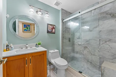 a white bath tub sitting next to a white toilet