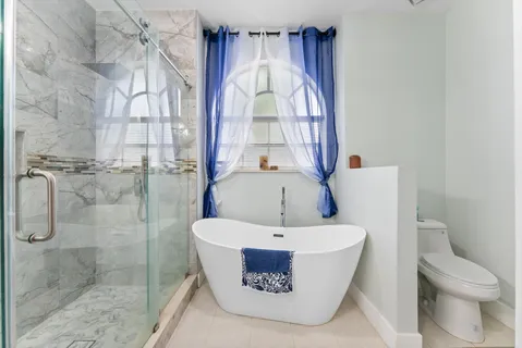 a view of walk in closet with clothes