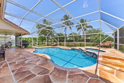 a view of a backyard with sitting area