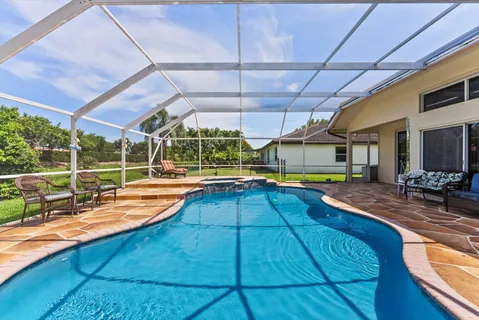 an aerial view of a house with a lake view