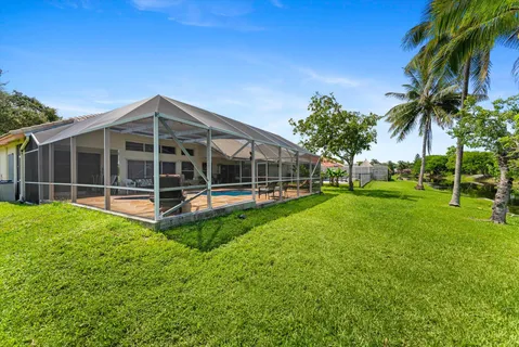 an aerial view of a houses with outdoor space and lake view