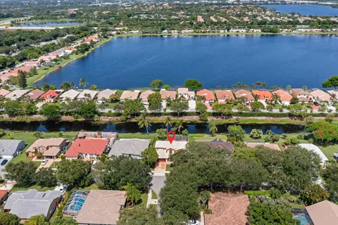 a picture of a room with a white wall and a refrigerator