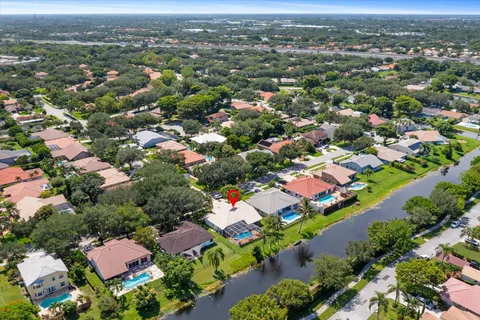 a picture of a room with a white wall and a refrigerator