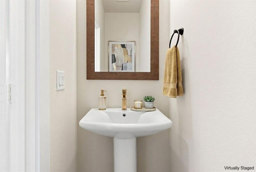 2028 Aldrich Road Celina, TX 75009 - Photo 18 of 40 a bathroom with a sink and a mirror