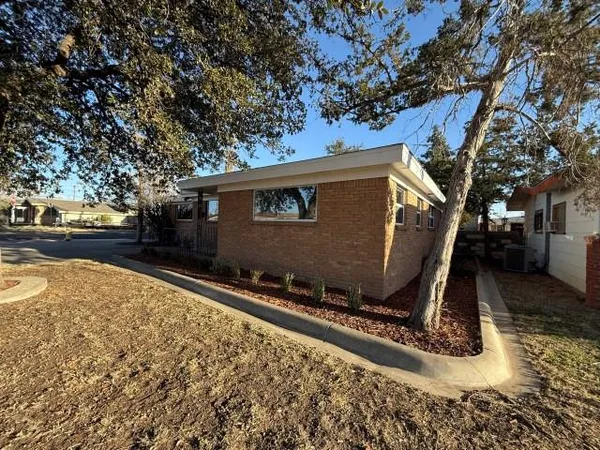 a view of a backyard of the house