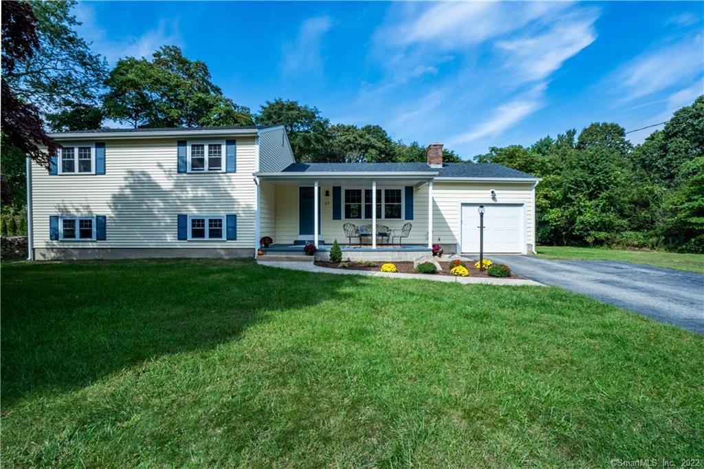 27 Old Black Point Road East Lyme, CT 06357 - Photo 1 of 1 a front view of house with yard and green space