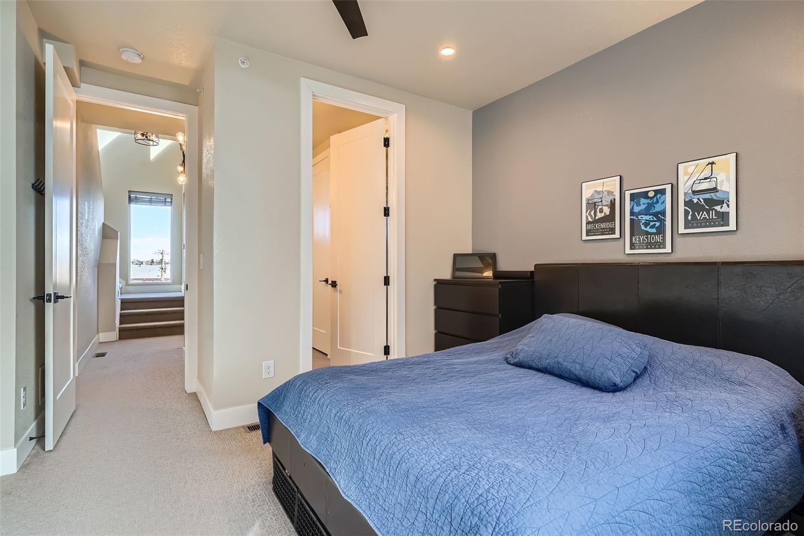 1583 Grove Street, Unit 5 Denver, CO 80204 - Photo 18 of 39 a bedroom with a bed and painting on the wall