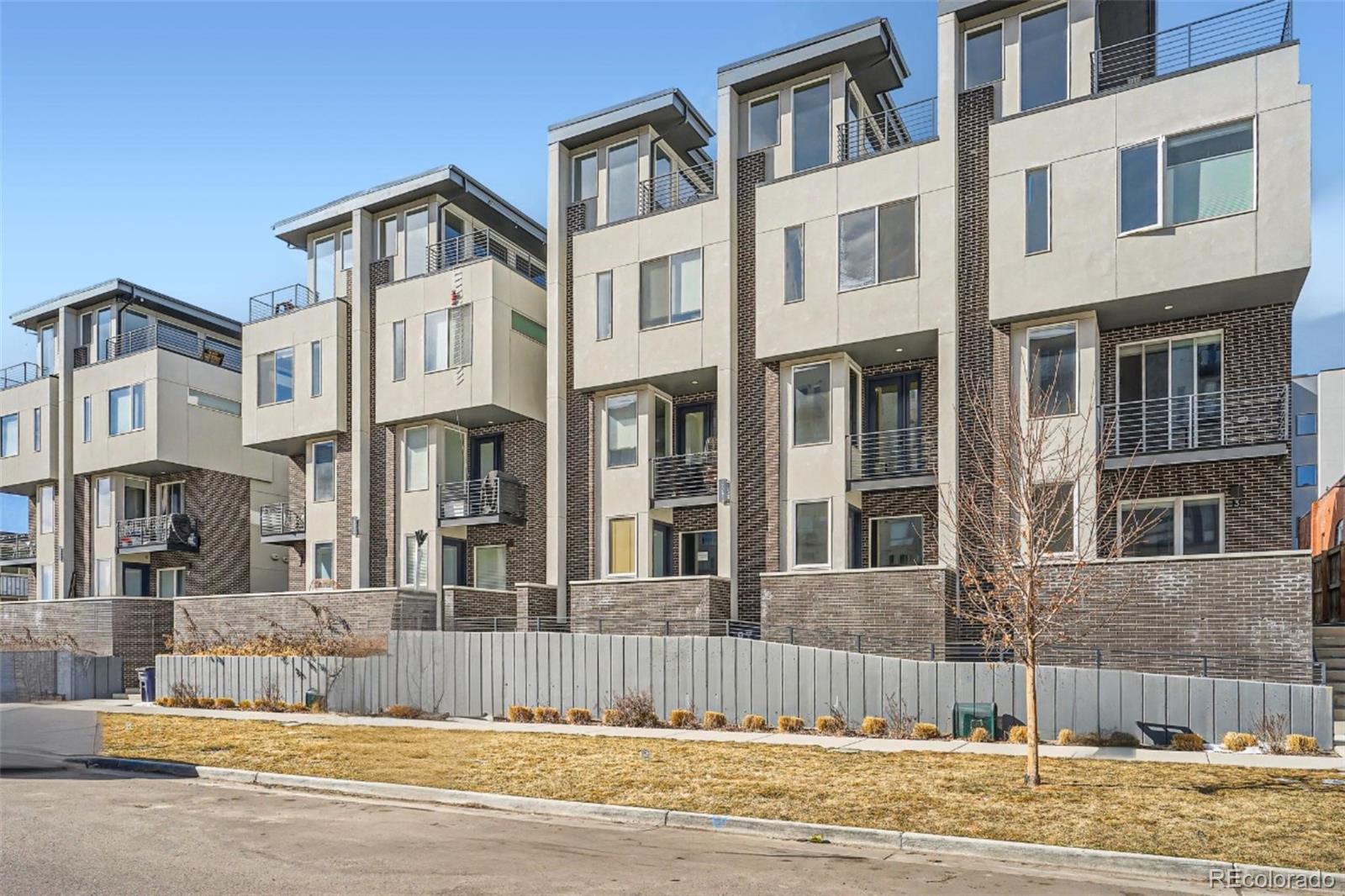 1583 Grove Street, Unit 5 Denver, CO 80204 - Photo 2 of 39 a view of a building with a fence