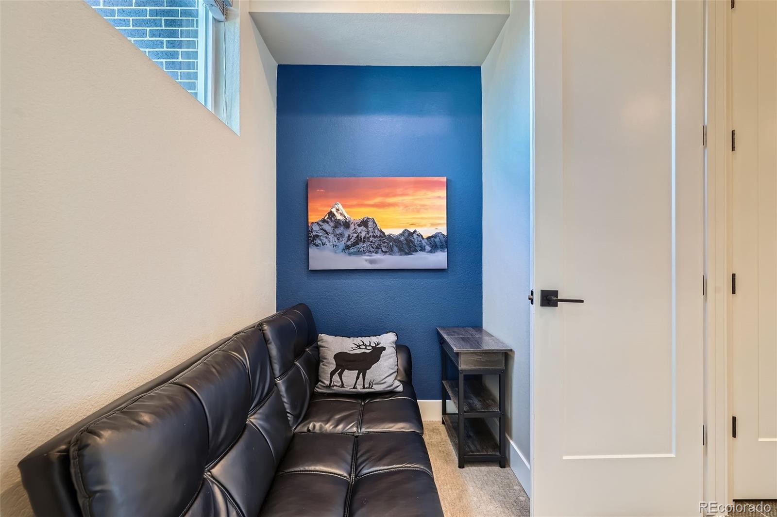 1583 Grove Street, Unit 5 Denver, CO 80204 - Photo 22 of 39 a living room with furniture and a flat screen tv