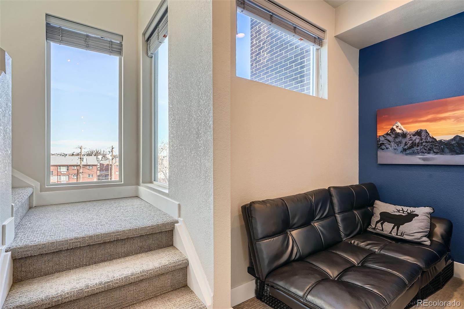 1583 Grove Street, Unit 5 Denver, CO 80204 - Photo 23 of 39 a living room with furniture and a window