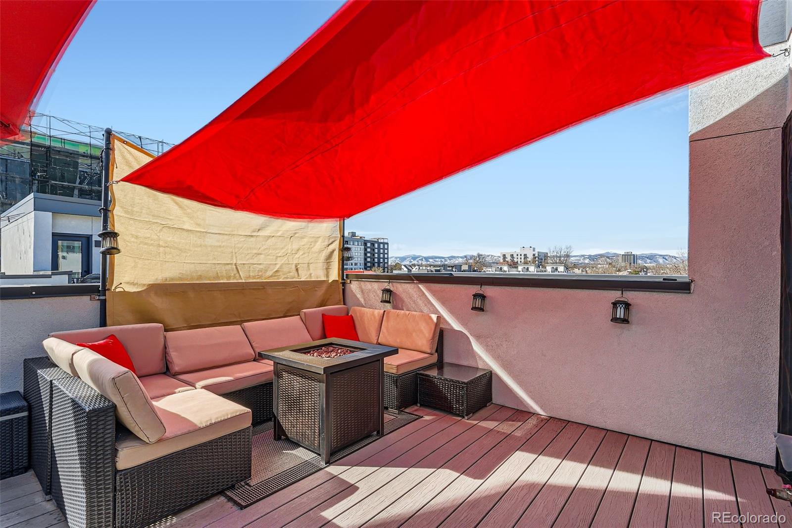 1583 Grove Street, Unit 5 Denver, CO 80204 - Photo 26 of 39 a balcony with wooden floor and furniture