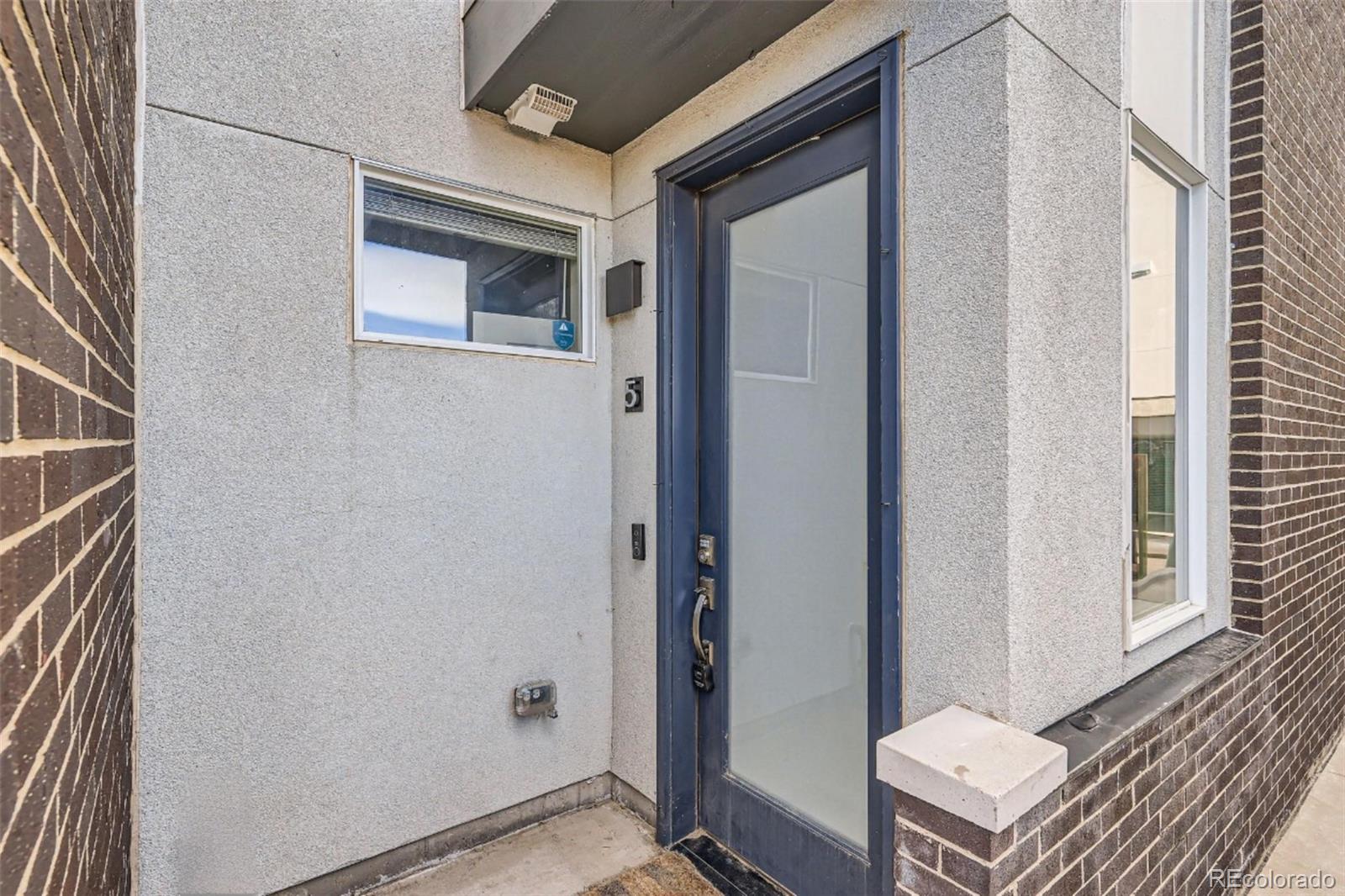 1583 Grove Street, Unit 5 Denver, CO 80204 - Photo 3 of 39 a view of a room that has a bench in it