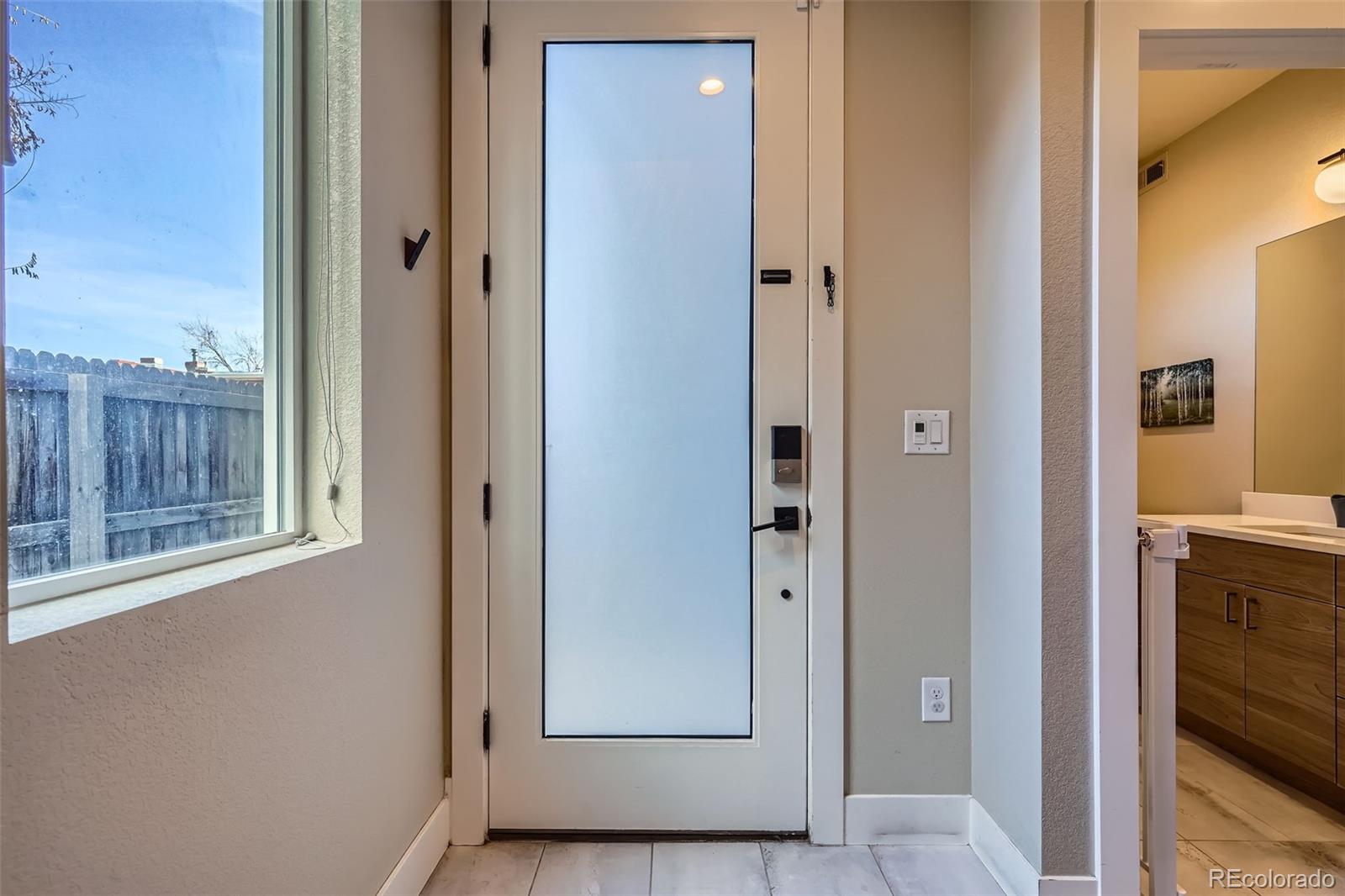 1583 Grove Street, Unit 5 Denver, CO 80204 - Photo 4 of 39 a view of an entryway with wooden floor