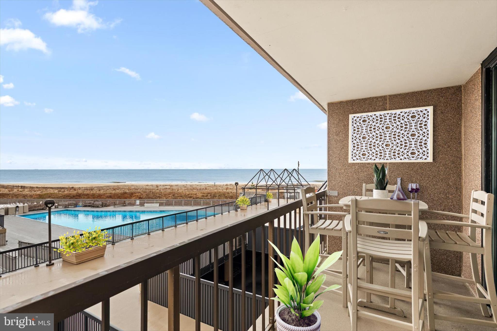a view of a balcony with an ocean
