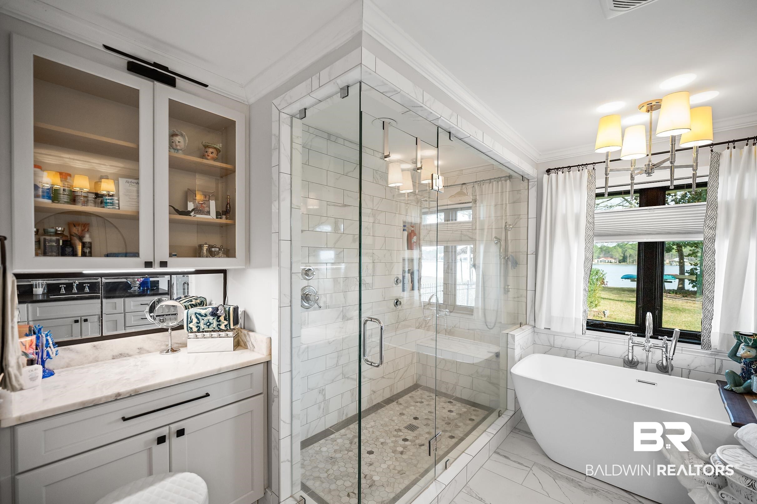 8490 Bay View Drive Foley, AL 36535 - Photo 40 of 67 Full bath with ornamental molding, a freestanding bath, light marble finish flooring, a stall shower, and tile walls