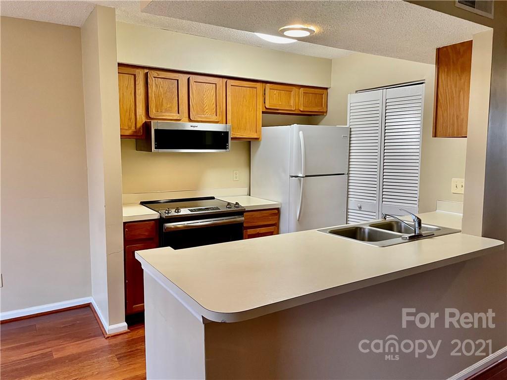 11046 Running Ridge Road Charlotte, NC 28226 - Photo 6 of 15 a kitchen with a appliances and a refrigerator