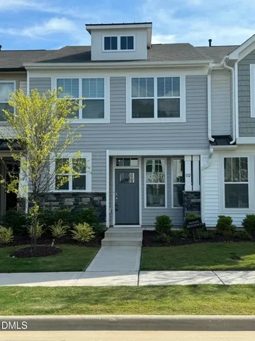 a kitchen with stainless steel appliances a refrigerator sink and microwave