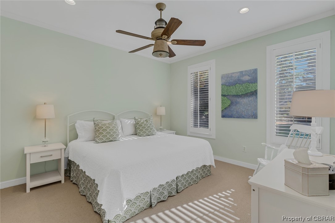 192 Bayberry Point Lane Kilmarnock, VA 22482 - Photo 42 of 49 Bedroom with ornamental molding, light carpet, and ceiling fan