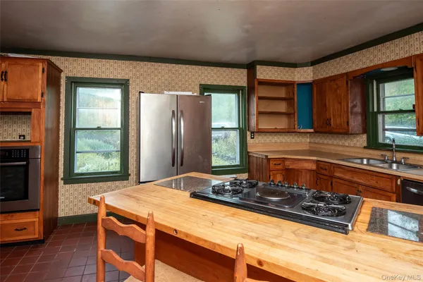 a view of a door and wooden floor