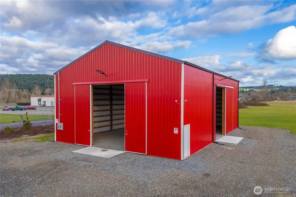 a backyard of a house with barbeque oven