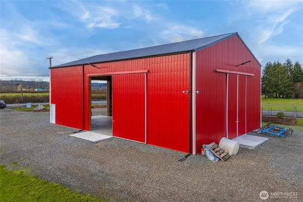 a view of empty room with stairs and wooden floor