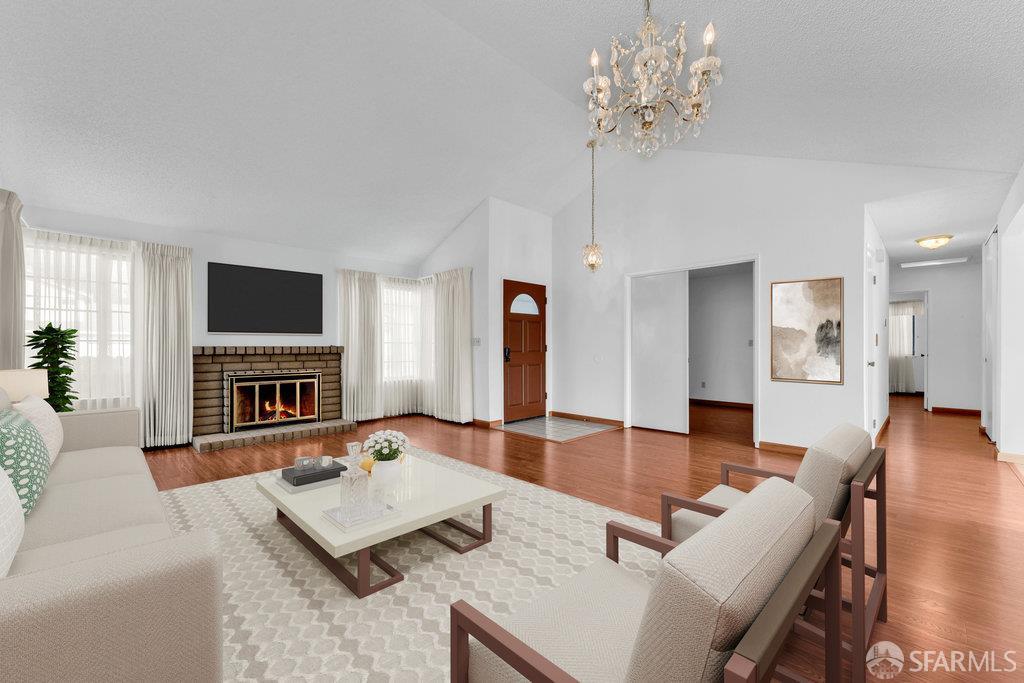 184 Pearce Hercules, CA 94547 - Photo 11 of 61 a living room with furniture a fireplace and a flat screen tv