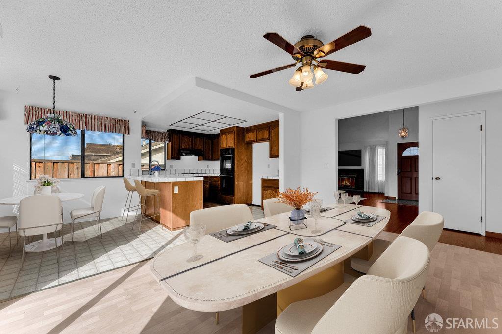 184 Pearce Hercules, CA 94547 - Photo 17 of 61 a view of a dining room with furniture and a chandelier