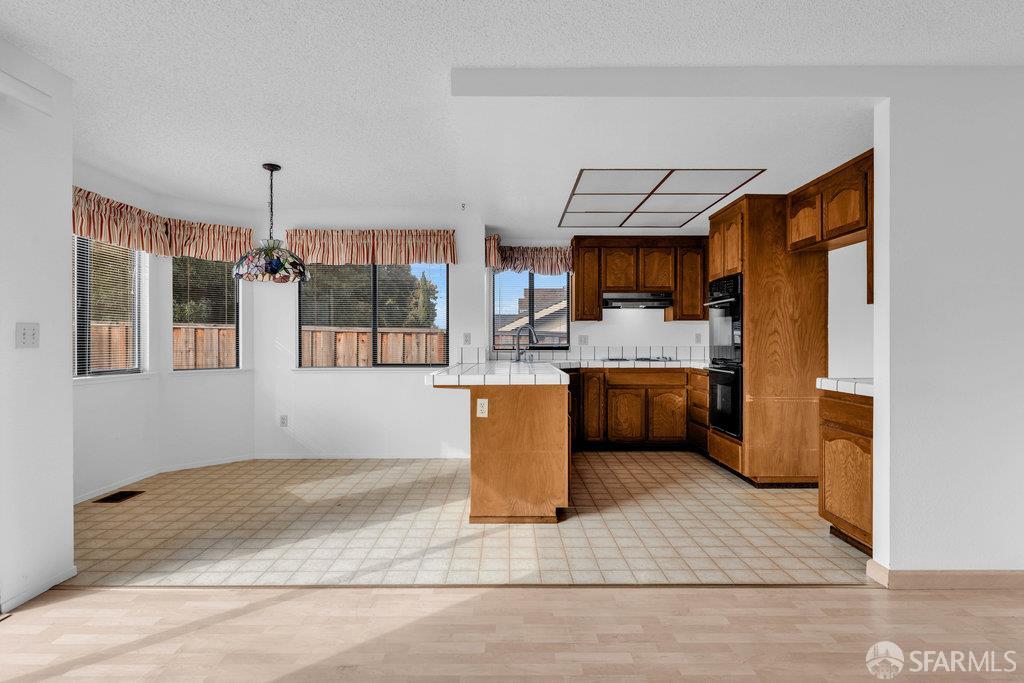 184 Pearce Hercules, CA 94547 - Photo 25 of 61 a kitchen with a sink cabinets and window