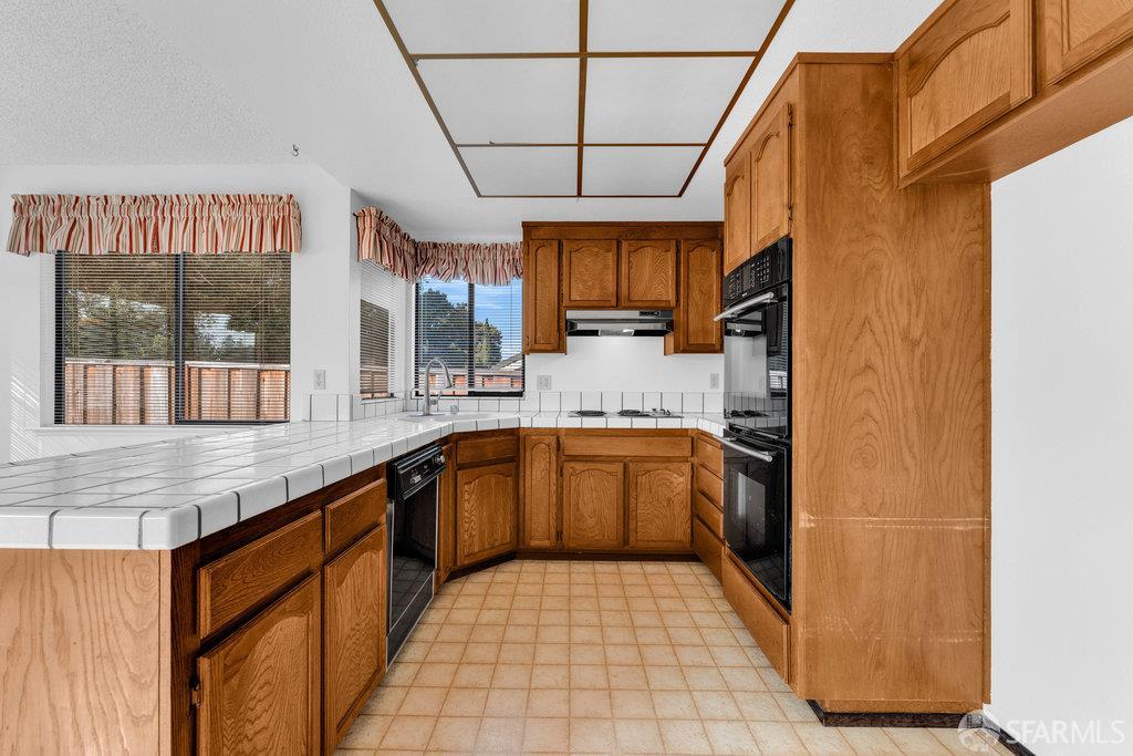 184 Pearce Hercules, CA 94547 - Photo 28 of 61 a large kitchen with a sink and cabinets