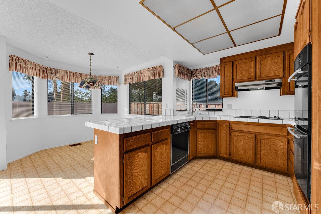 184 Pearce Hercules, CA 94547 - Photo 30 of 61 a kitchen with stainless steel appliances granite countertop a sink and a stove