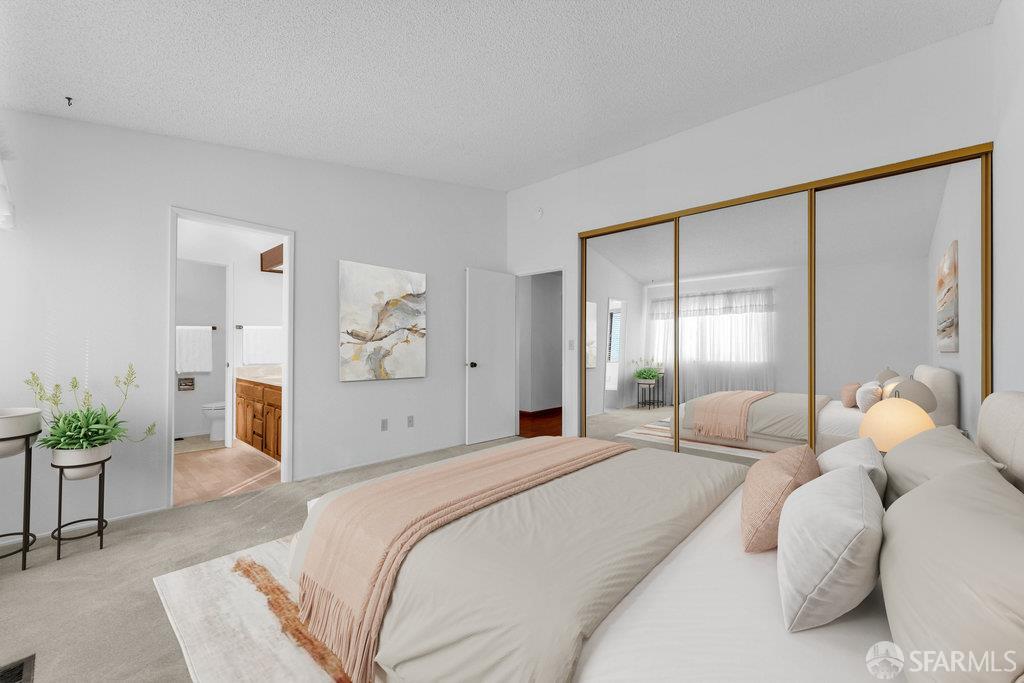 184 Pearce Hercules, CA 94547 - Photo 33 of 61 a spacious bedroom with a bed and a couch