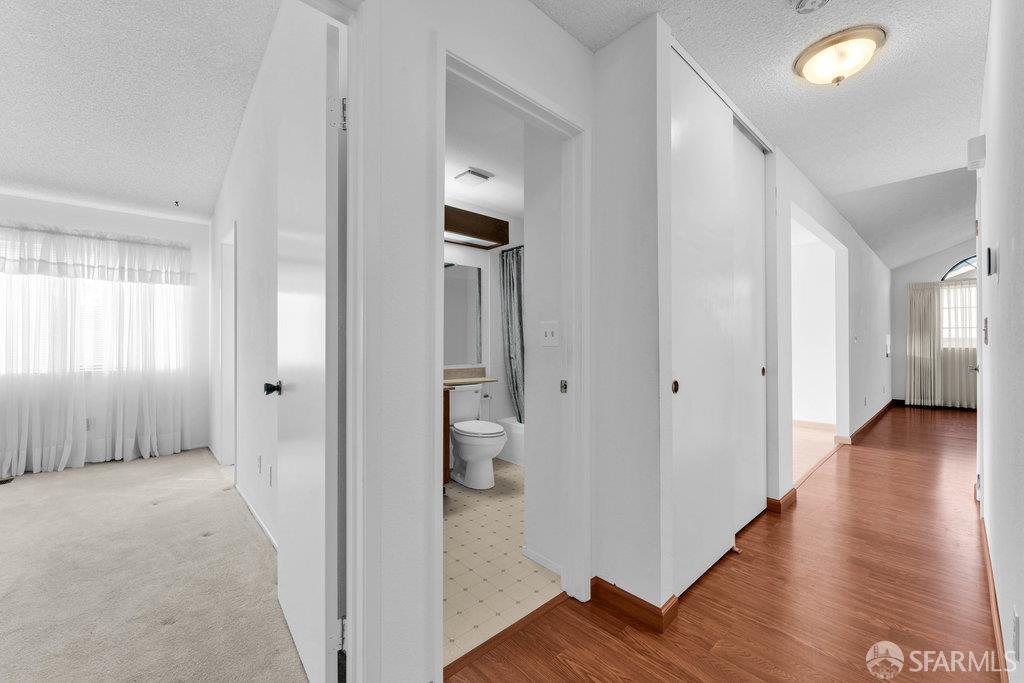 184 Pearce Hercules, CA 94547 - Photo 37 of 61 a view of a hallway with wooden floor