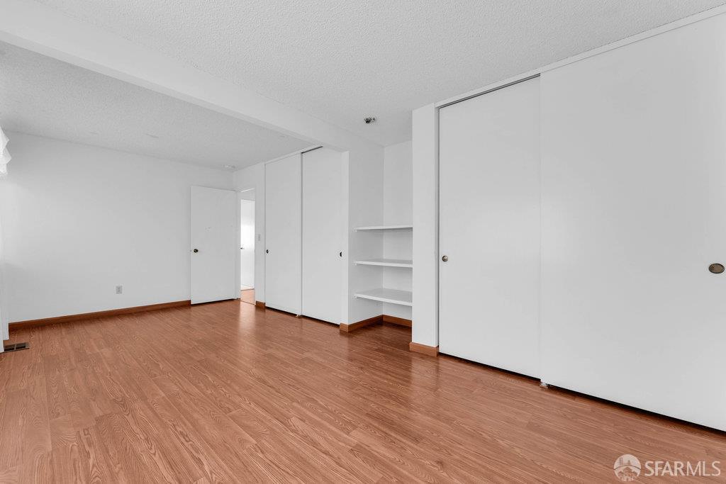 184 Pearce Hercules, CA 94547 - Photo 41 of 61 a view of an empty room with wooden floor