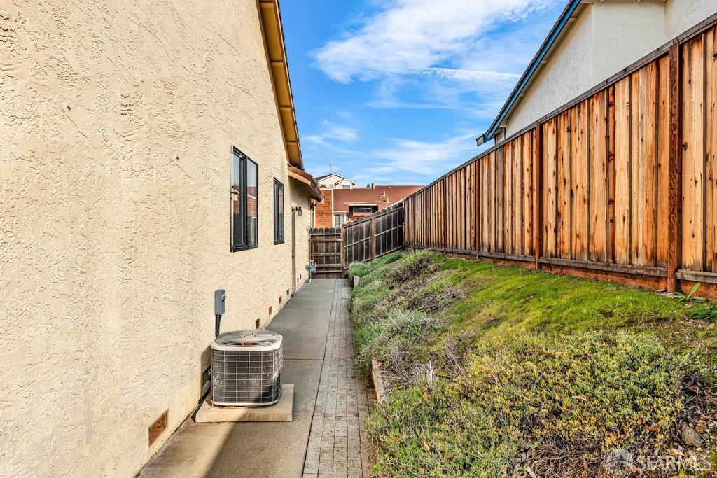 184 Pearce Hercules, CA 94547 - Photo 58 of 61 a view of a backyard with chair and wooden fence
