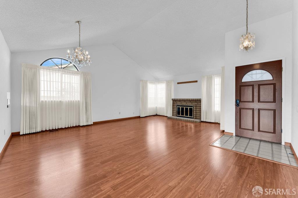 184 Pearce Hercules, CA 94547 - Photo 10 of 61 a view of livingroom with hardwood floor and window