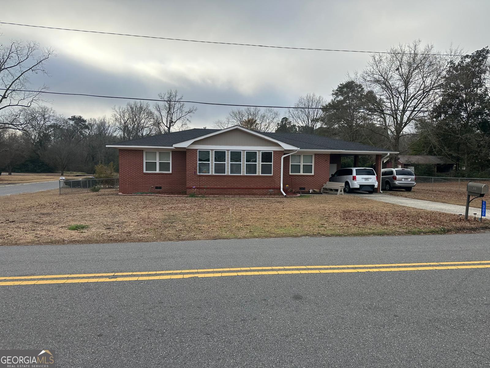 front view of a house with a big yard