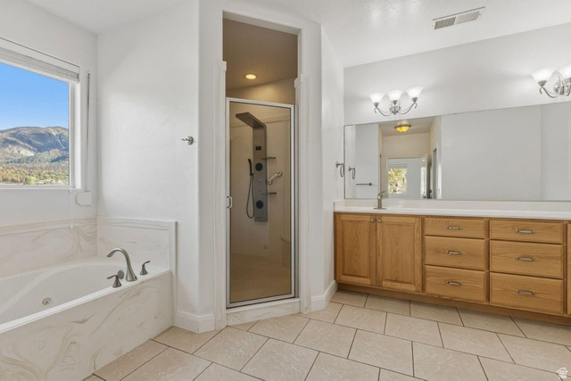1001 Pine Valley Road Pine Valley, UT 84781 - Photo 41 of 49 Full bathroom with a shower stall, vanity, a bath, and light tile patterned flooring