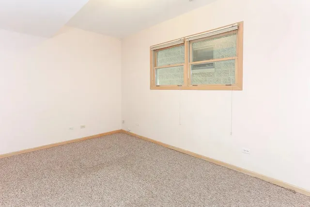 a view of a balcony with wooden floor