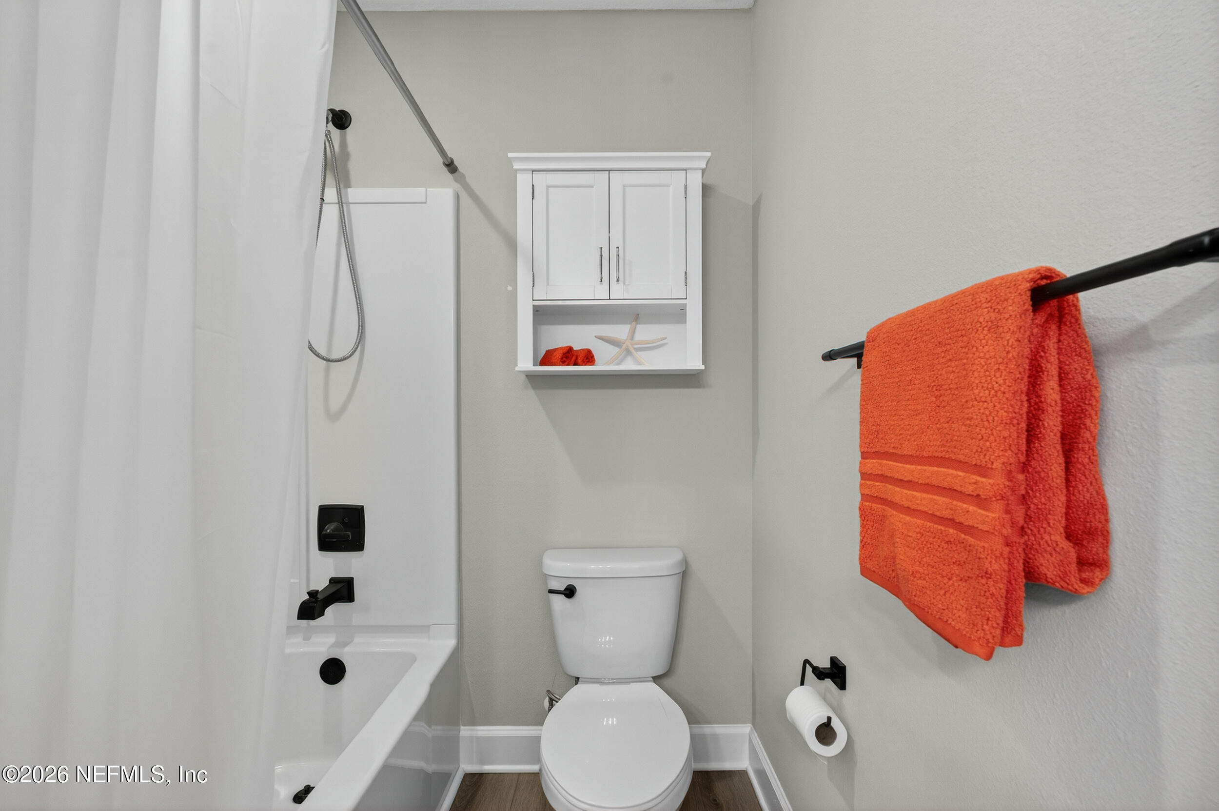 57 Cedar Elm Way St. Augustine, FL 32092 - Photo 31 of 65 a bathroom with a shower curtain and a toilet