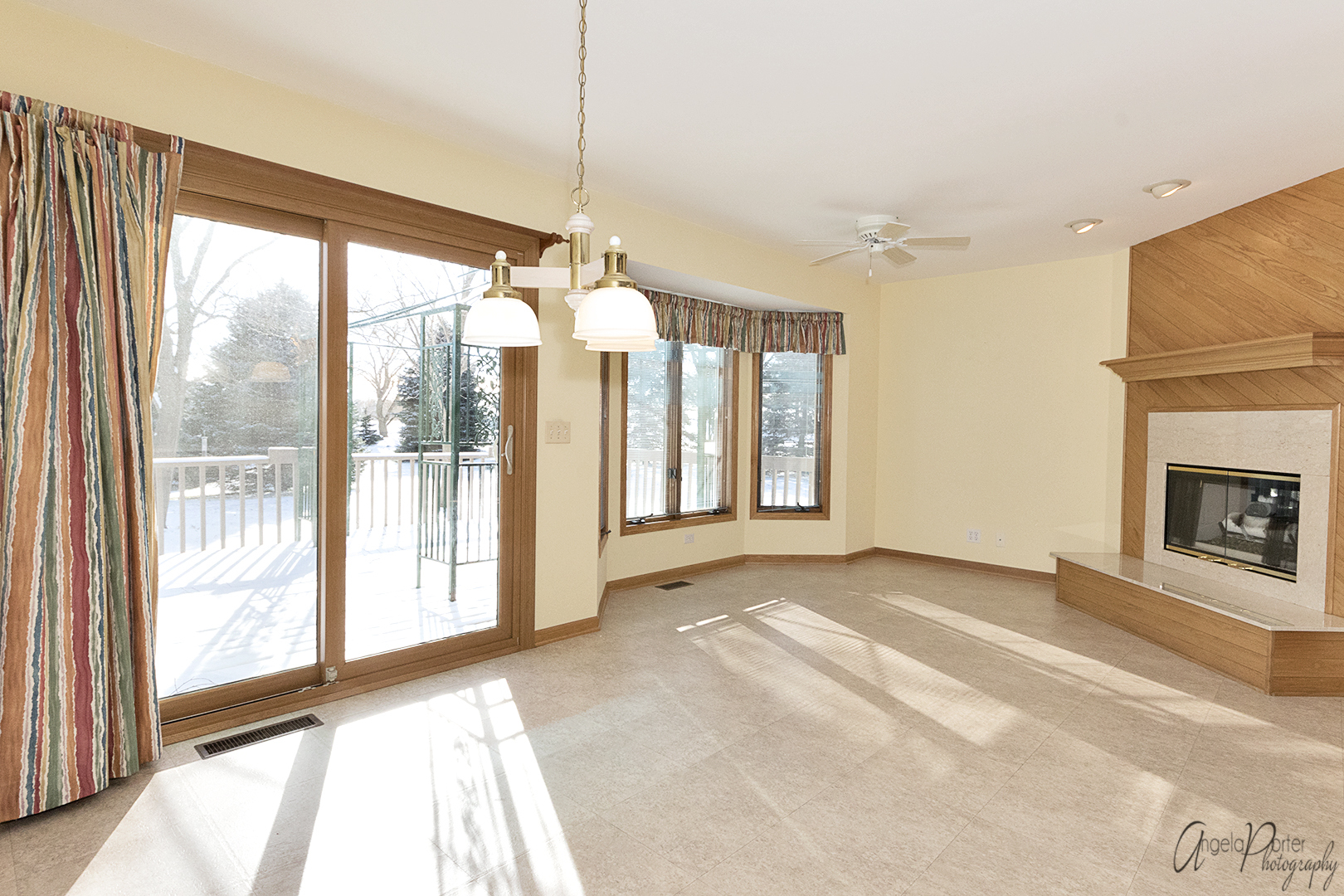 1409 Elm Street Spring Grove, IL 60081 - Photo 12 of 28 a view of an empty room with a fireplace and a window