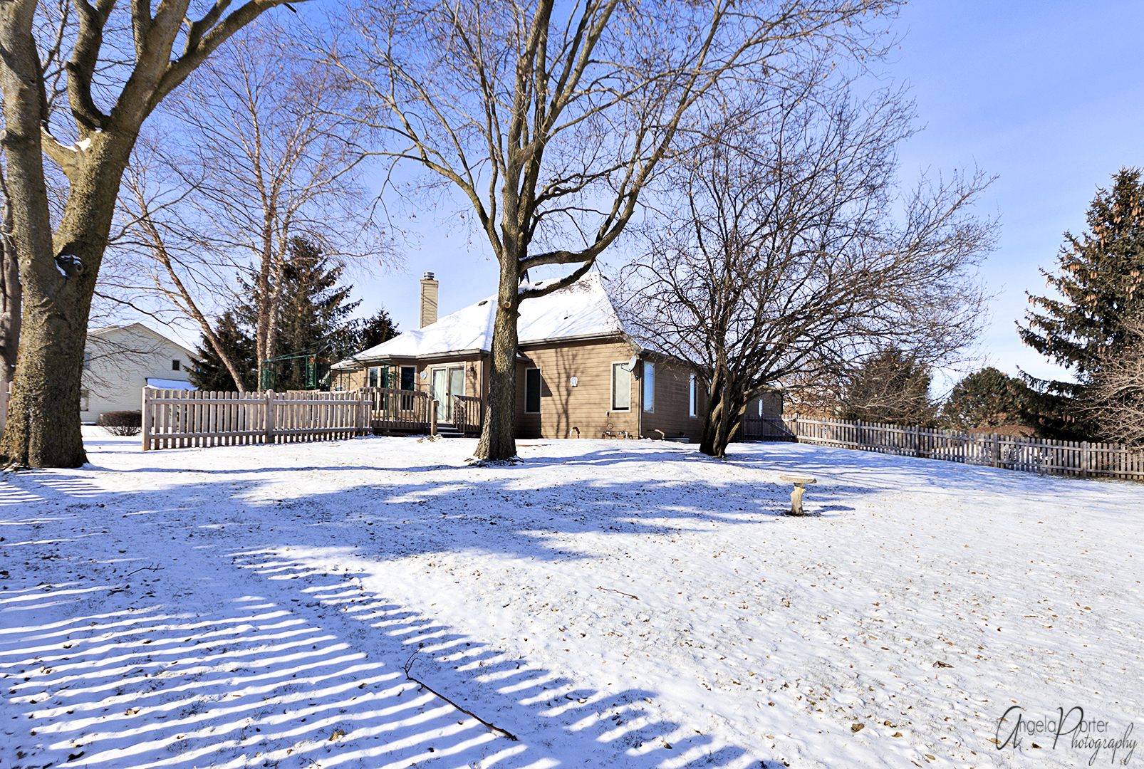 1409 Elm Street Spring Grove, IL 60081 - Photo 27 of 28 a view of white house with a yard covered in snow