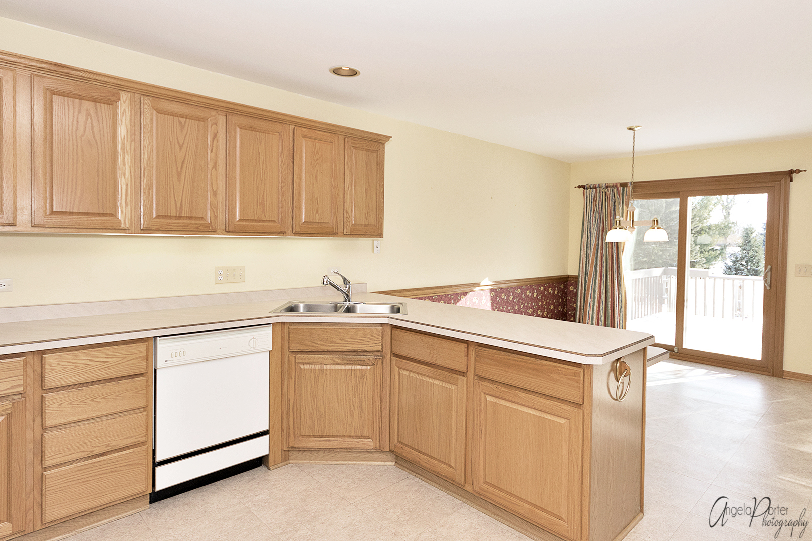 1409 Elm Street Spring Grove, IL 60081 - Photo 8 of 28 a kitchen with white cabinets and white appliances