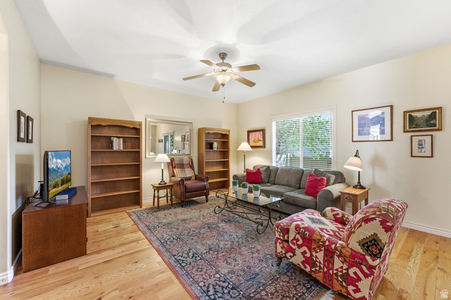7235 Viansa Court Midvale, UT 84047 - Photo 4 of 43 Living room with light wood-style flooring and ceiling fan