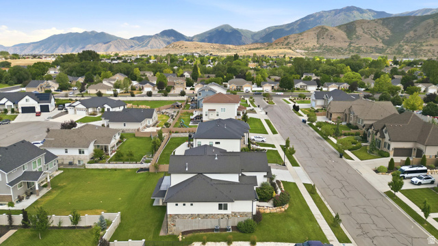 1002 West Temple Rim Lane Payson, UT 84651 - Photo 68 of 68 Expansive neighborhood with diverse architectural styles, mature landscaping, and mountain backdrop