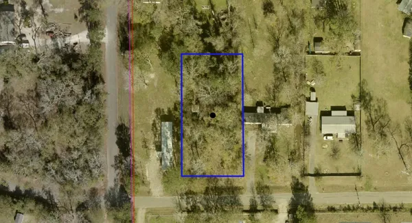 a view of a field with trees