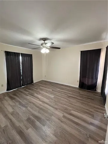 a view of a livingroom with wooden floor