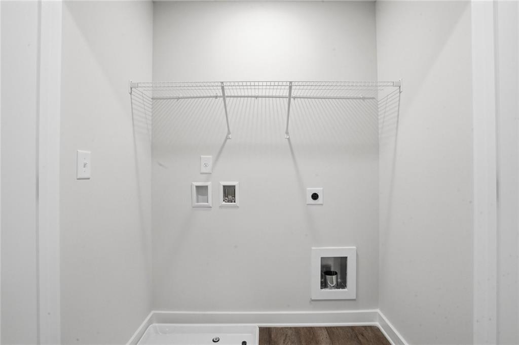 5351 Tolar Road South Fulton, GA 30213 - Photo 14 of 30 a bathroom with a window and a shower