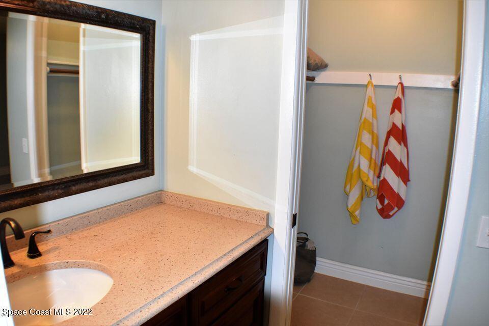 3335 Jay Tee Drive Melbourne, FL 32901 - Photo 16 of 37 a bathroom with a sink and a mirror